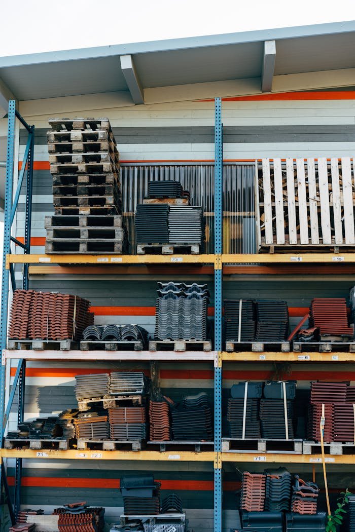 creative-03 Neatly stacked building materials in a warehouse setting, showcasing construction organization.