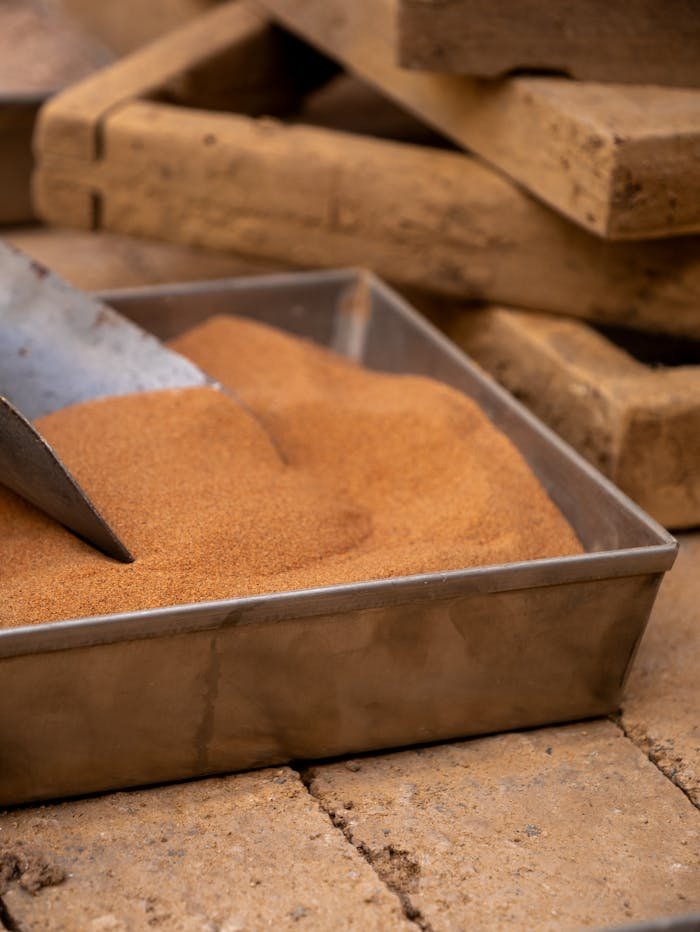 mobile-02 Detailed shot of fine sand in a metal tray used for bricklaying or construction work.